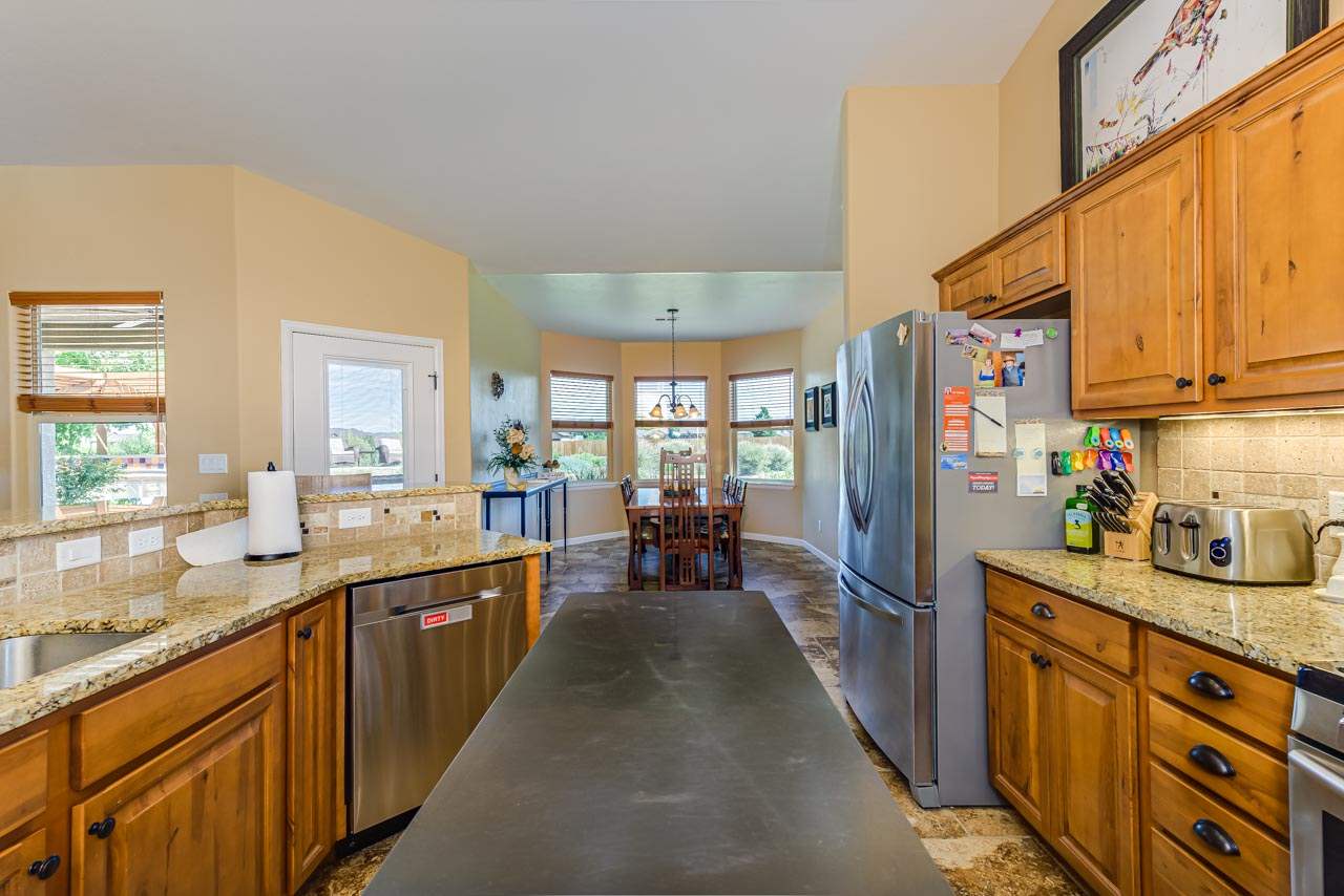 2530 Riata Ranch Court Grand Junction, CO 81505 - Photo 14 of 41 a kitchen with lots of counter top space