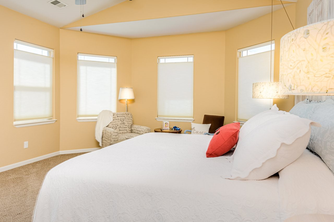 2530 Riata Ranch Court Grand Junction, CO 81505 - Photo 19 of 41 a bedroom with a bed and a large window