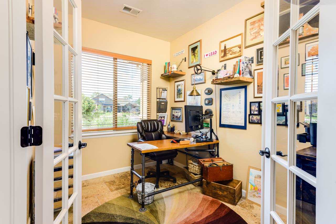 2530 Riata Ranch Court Grand Junction, CO 81505 - Photo 22 of 41 a view of a workspace with furniture and a window