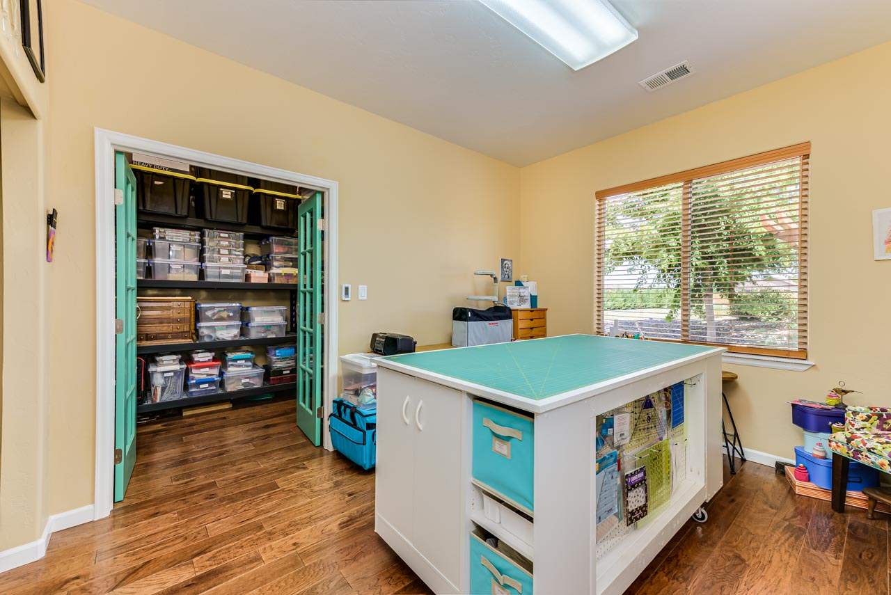 2530 Riata Ranch Court Grand Junction, CO 81505 - Photo 27 of 41 a kitchen that has a stove and a wooden floor