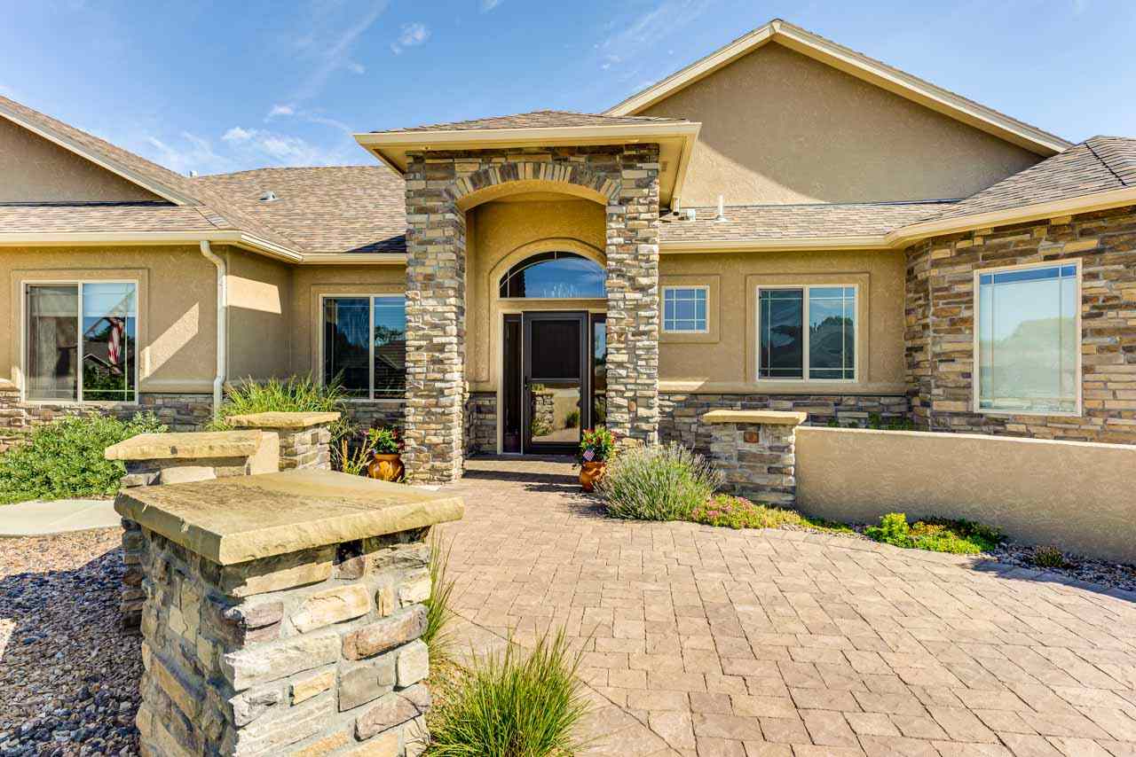 2530 Riata Ranch Court Grand Junction, CO 81505 - Photo 3 of 41 a view of a house with outdoor space and porch