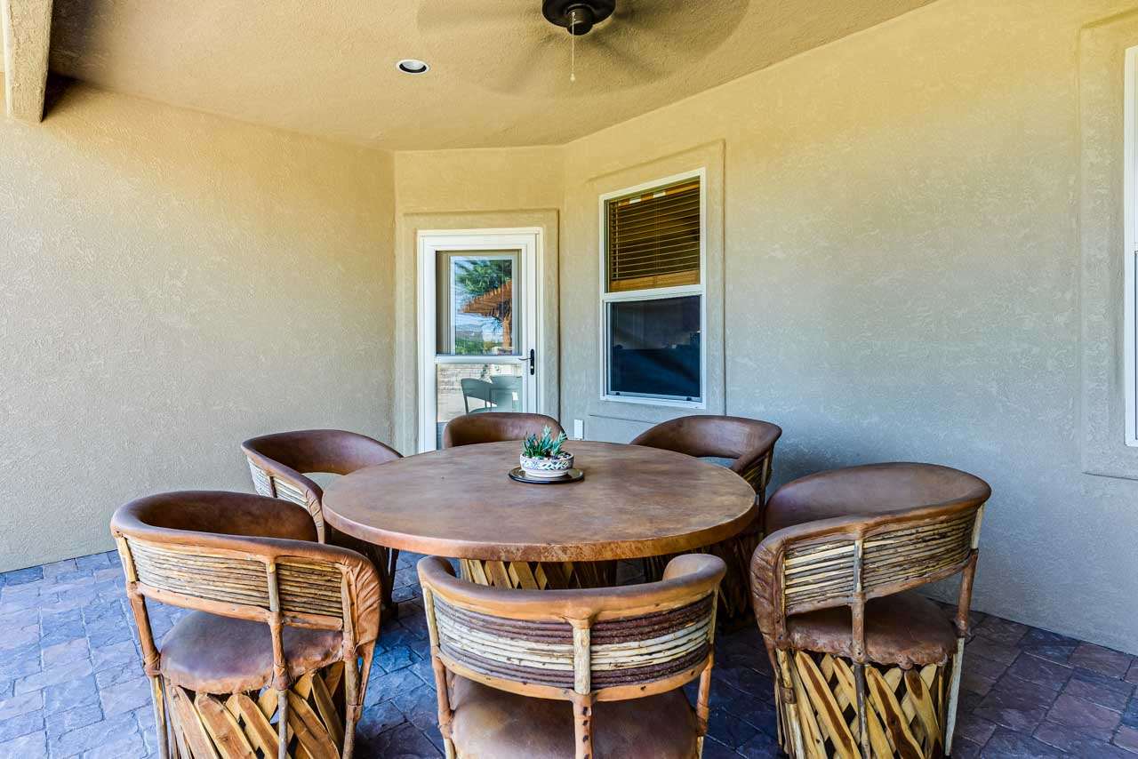 2530 Riata Ranch Court Grand Junction, CO 81505 - Photo 34 of 41 a view of a dining room with furniture and wooden floor