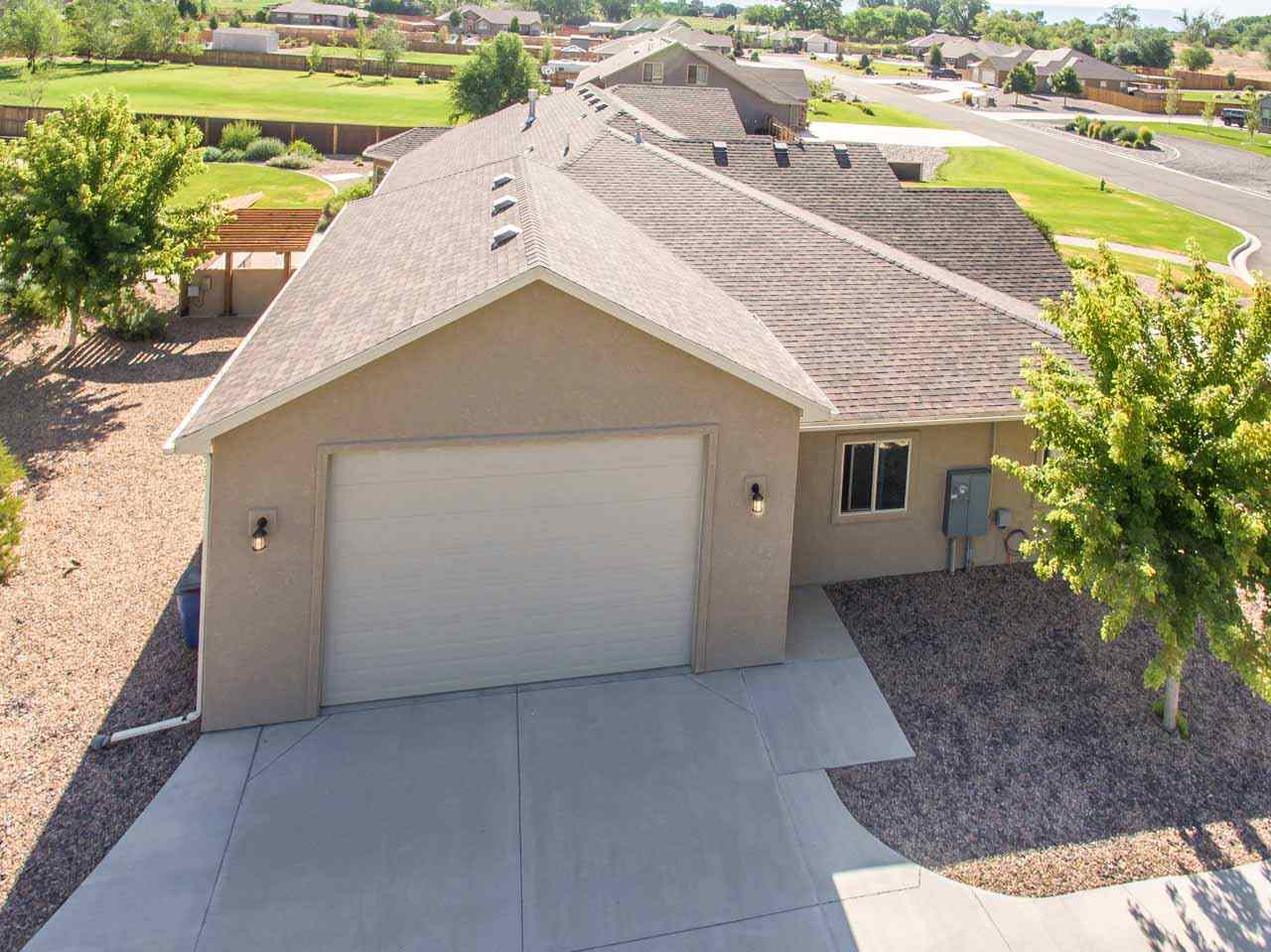 2530 Riata Ranch Court Grand Junction, CO 81505 - Photo 39 of 41 a view of a house with a swimming pool
