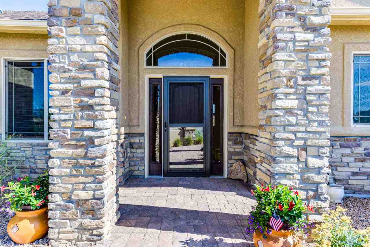 2530 Riata Ranch Court Grand Junction, CO 81505 - Photo 4 of 41 a view of front door of house and outdoor space