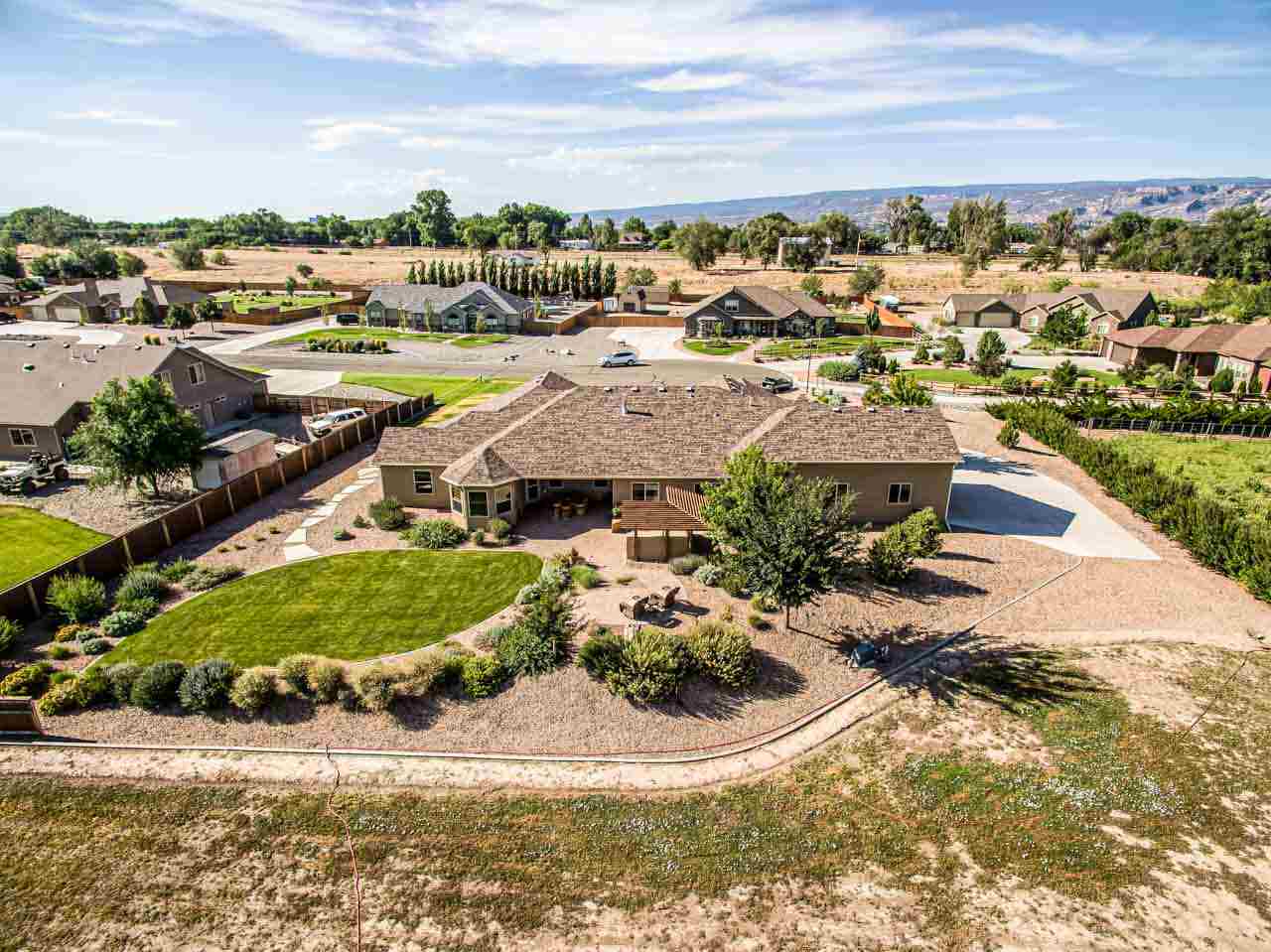 2530 Riata Ranch Court Grand Junction, CO 81505 - Photo 41 of 41 an aerial view of residential houses with outdoor space