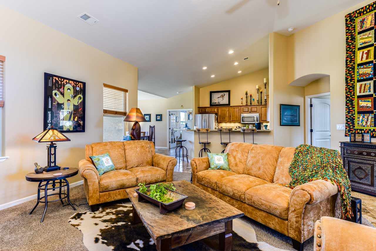 2530 Riata Ranch Court Grand Junction, CO 81505 - Photo 7 of 41 a living room with furniture and a dining table