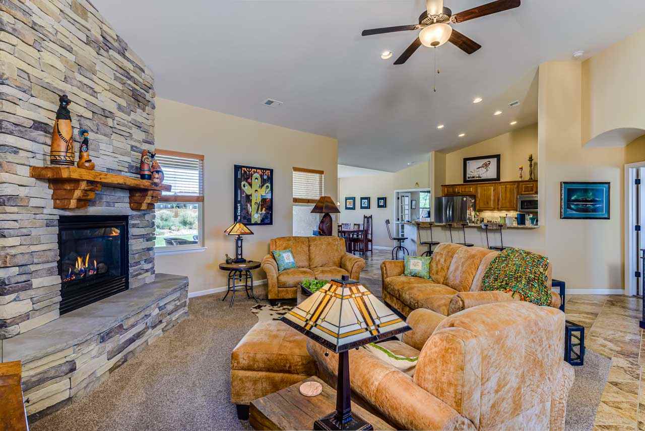 2530 Riata Ranch Court Grand Junction, CO 81505 - Photo 8 of 41 a living room with furniture and a fireplace