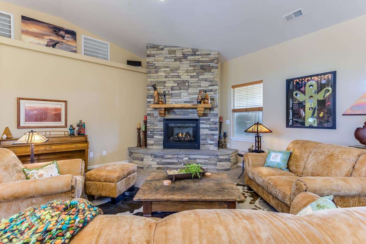 2530 Riata Ranch Court Grand Junction, CO 81505 - Photo 9 of 41 a living room with furniture and a fireplace