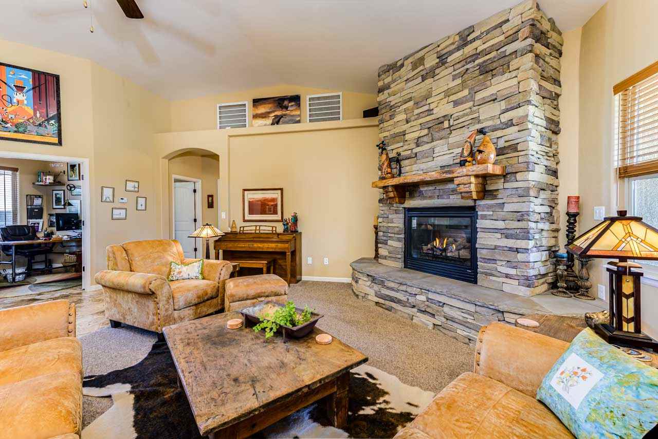 2530 Riata Ranch Court Grand Junction, CO 81505 - Photo 10 of 41 a living room with furniture and a fireplace