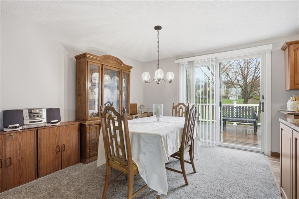 106 Squirrel Hollow Road Gibsonia, PA 15044 - Photo 16 of 46 a view of a dining room with furniture window and wooden floor