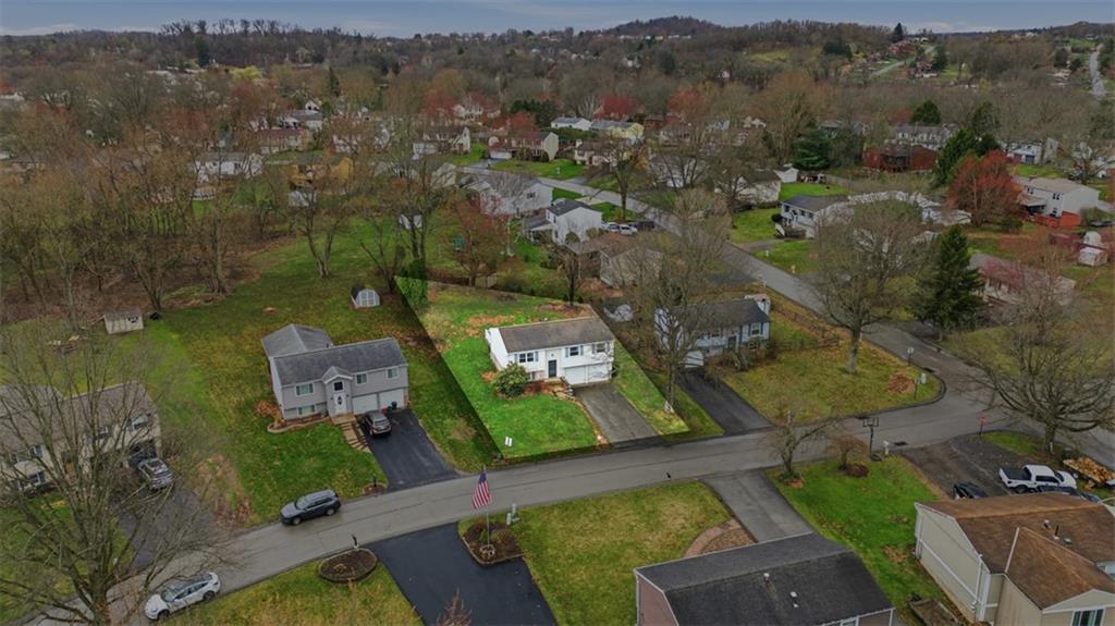 106 Squirrel Hollow Road Gibsonia, PA 15044 - Photo 2 of 46 an aerial view of a city with lots of residential buildings