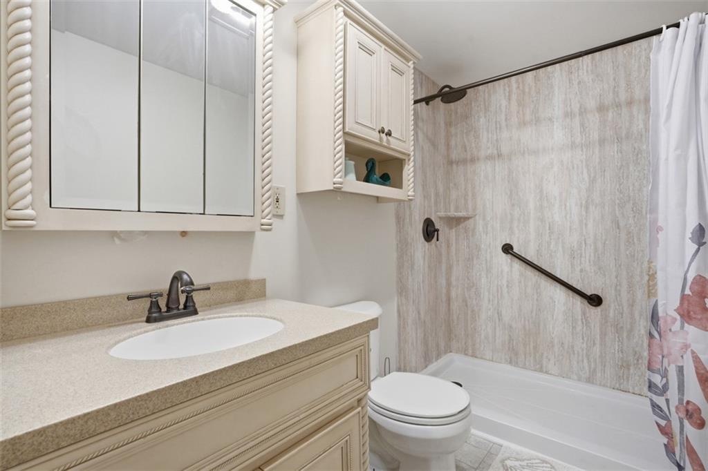 106 Squirrel Hollow Road Gibsonia, PA 15044 - Photo 21 of 46 a bathroom with a sink a toilet and a shower