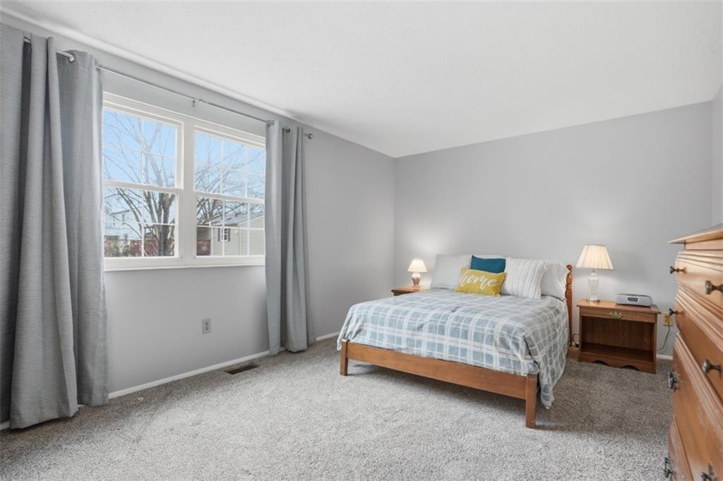 106 Squirrel Hollow Road Gibsonia, PA 15044 - Photo 22 of 46 a bedroom with a bed and a window