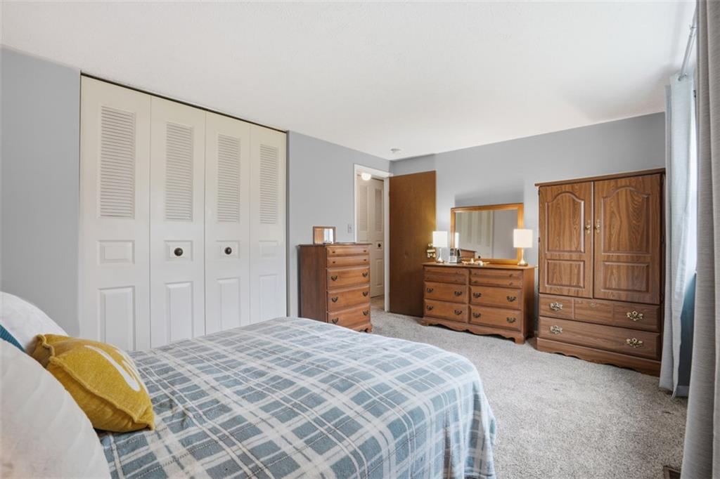 106 Squirrel Hollow Road Gibsonia, PA 15044 - Photo 23 of 46 a bedroom with a bed and furniture