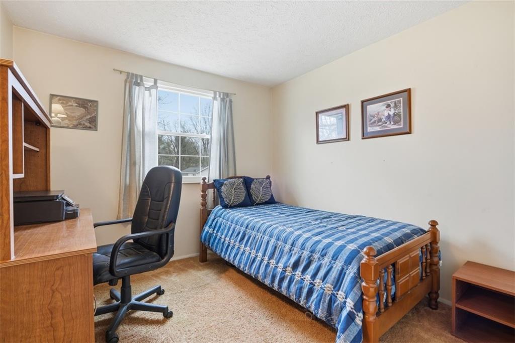 106 Squirrel Hollow Road Gibsonia, PA 15044 - Photo 25 of 46 a bedroom with a bed chair and a window