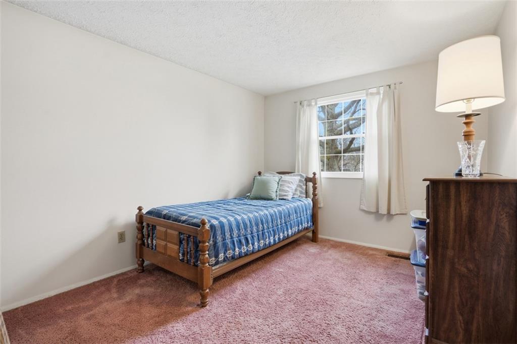 106 Squirrel Hollow Road Gibsonia, PA 15044 - Photo 27 of 46 a room with a bed and a window