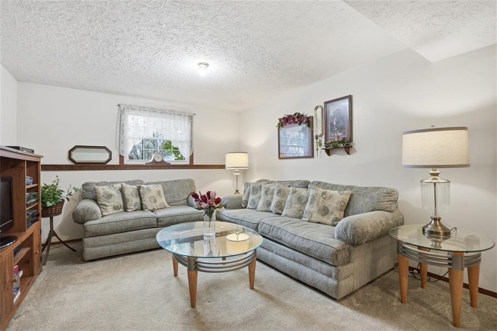 106 Squirrel Hollow Road Gibsonia, PA 15044 - Photo 30 of 46 a living room with furniture and a large window