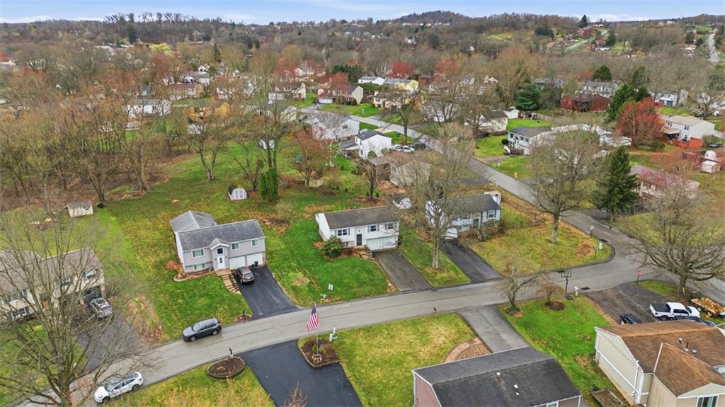 106 Squirrel Hollow Road Gibsonia, PA 15044 - Photo 3 of 46 an aerial view of a house with a garden