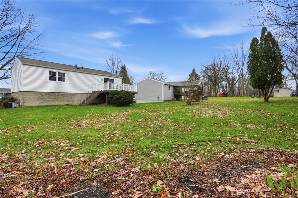 106 Squirrel Hollow Road Gibsonia, PA 15044 - Photo 38 of 46 a view of a house with a big yard