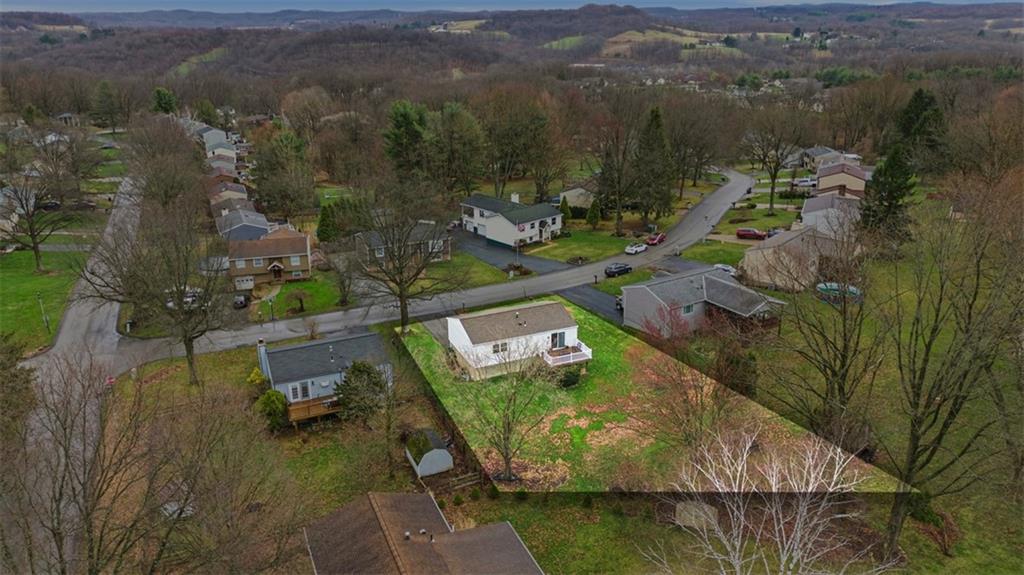 106 Squirrel Hollow Road Gibsonia, PA 15044 - Photo 44 of 46 an aerial view of a house with a lake view
