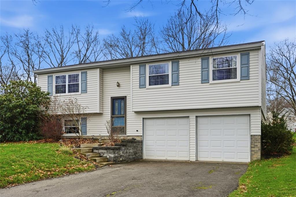 106 Squirrel Hollow Road Gibsonia, PA 15044 - Photo 6 of 46 a front view of a house with a yard
