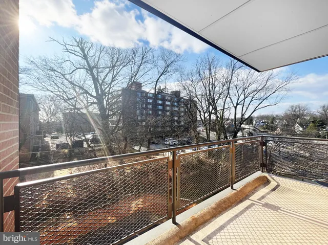 a view of balcony with wooden floor and fence