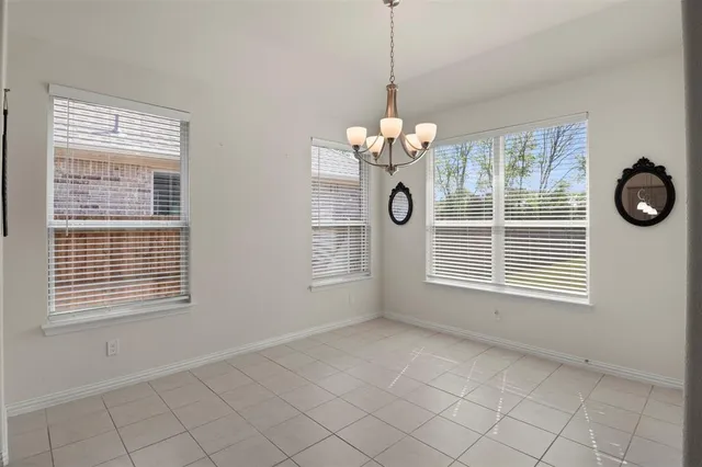 a kitchen with granite countertop a sink and cabinets