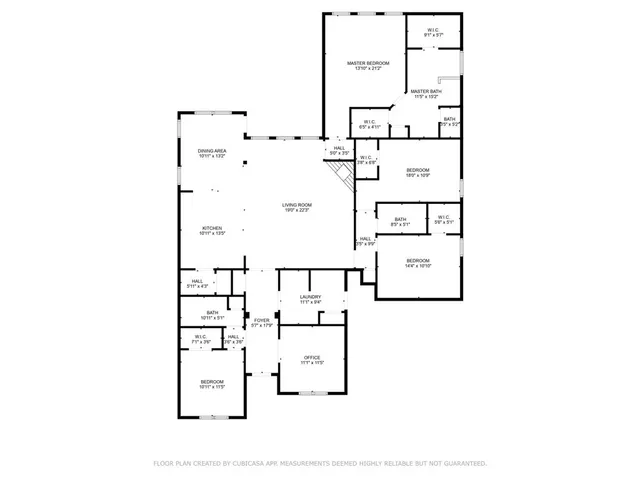 a front view of a house with a garden and trees