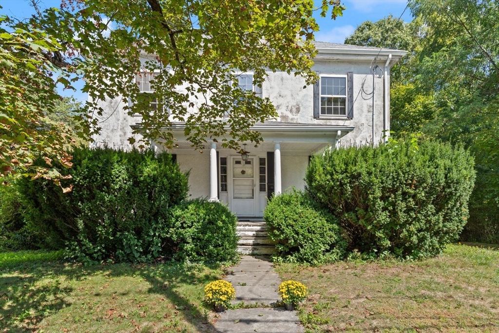front view of a house with a yard