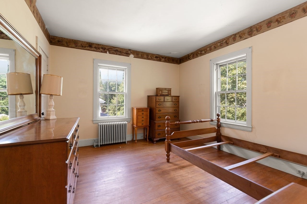 17 Pine Road Sharon, MA 02067 - Photo 20 of 33 a bedroom with furniture and a window