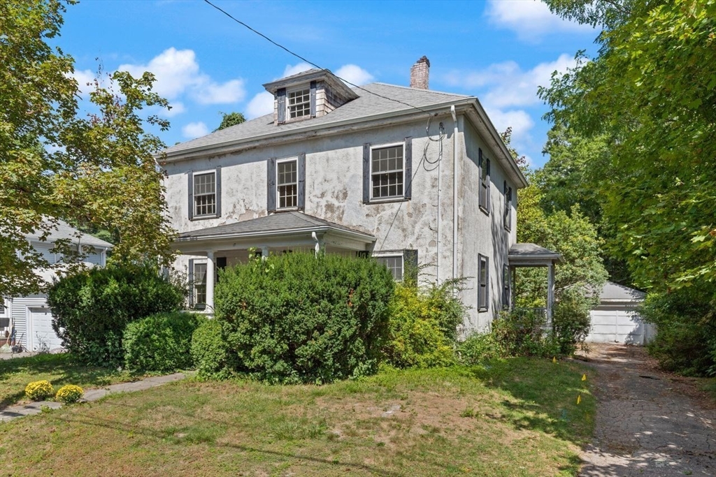 17 Pine Road Sharon, MA 02067 - Photo 2 of 33 a front view of a house with garden