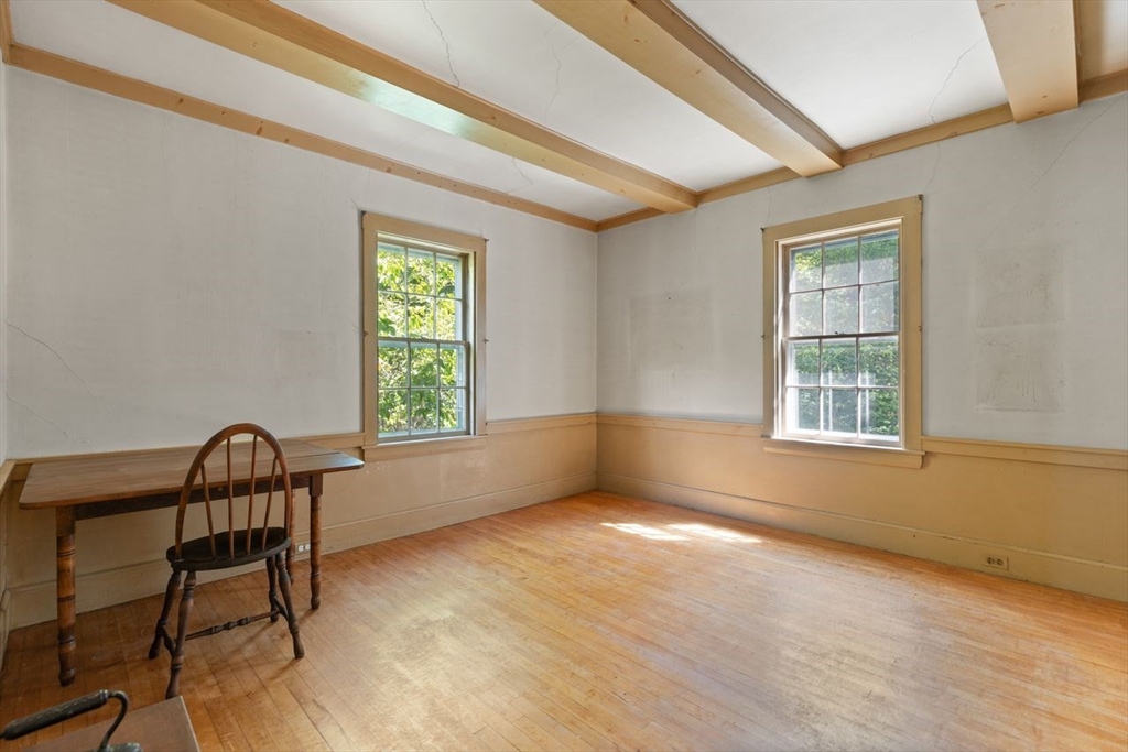 17 Pine Road Sharon, MA 02067 - Photo 23 of 33 a view of a room that has a window and wooden floor