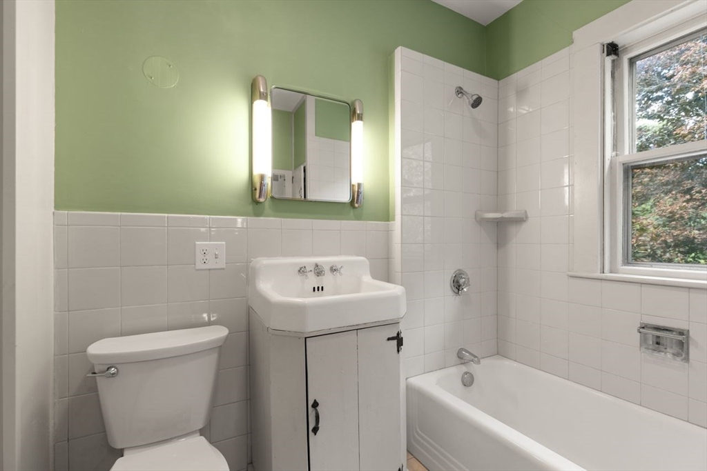 17 Pine Road Sharon, MA 02067 - Photo 24 of 33 a bathroom with a sink a toilet and shower