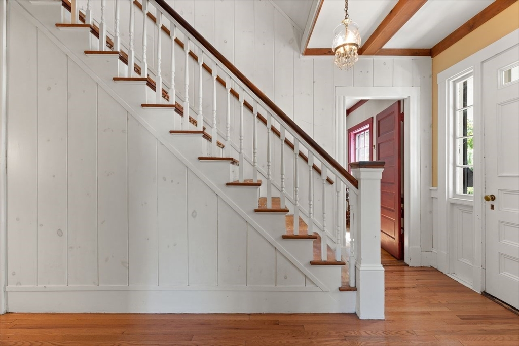 17 Pine Road Sharon, MA 02067 - Photo 5 of 33 a view of staircase with wooden floor and white walls