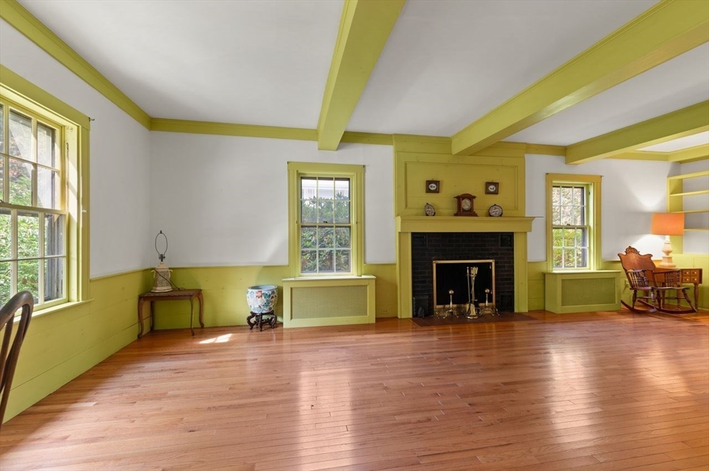 17 Pine Road Sharon, MA 02067 - Photo 7 of 33 a living room with furniture and a fireplace