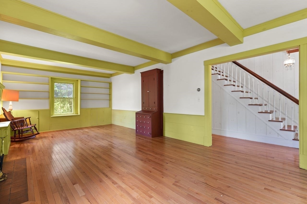 17 Pine Road Sharon, MA 02067 - Photo 10 of 33 a view of empty room with wooden floor and fan