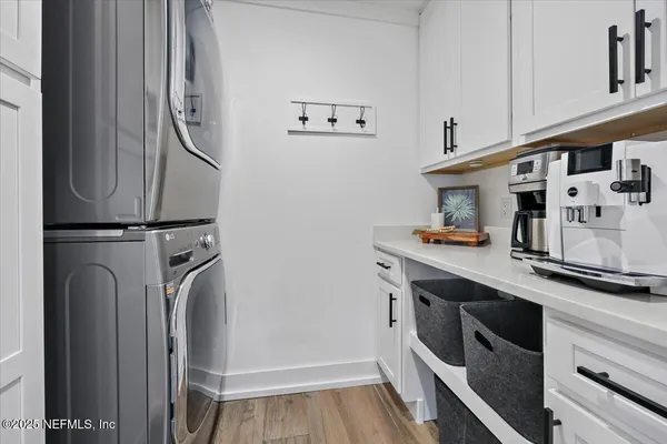 a kitchen with stainless steel appliances granite countertop a refrigerator and a stove