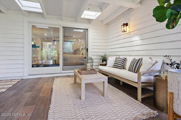 a living room with furniture and a rug