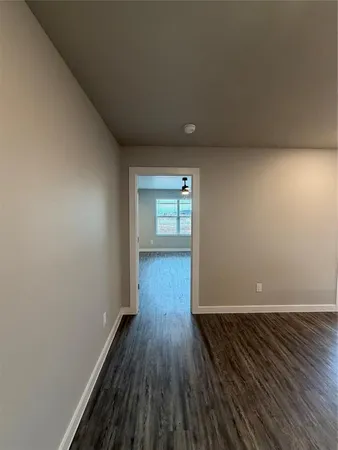 a view of wooden floor and windows in a room