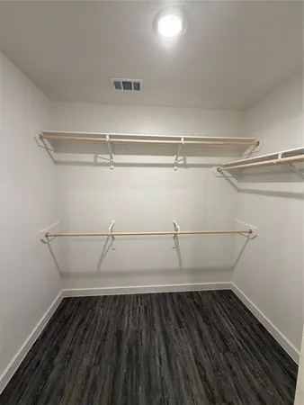 a view of a room with racks on the wall