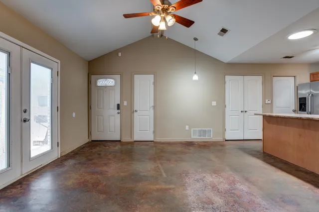 a view of an empty room with a window