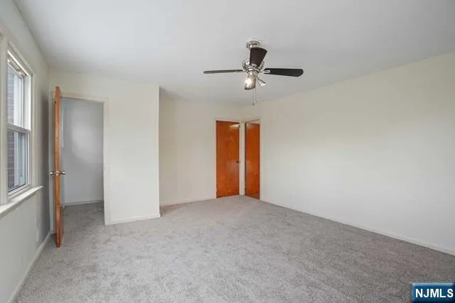 a view of an empty room with a bathroom