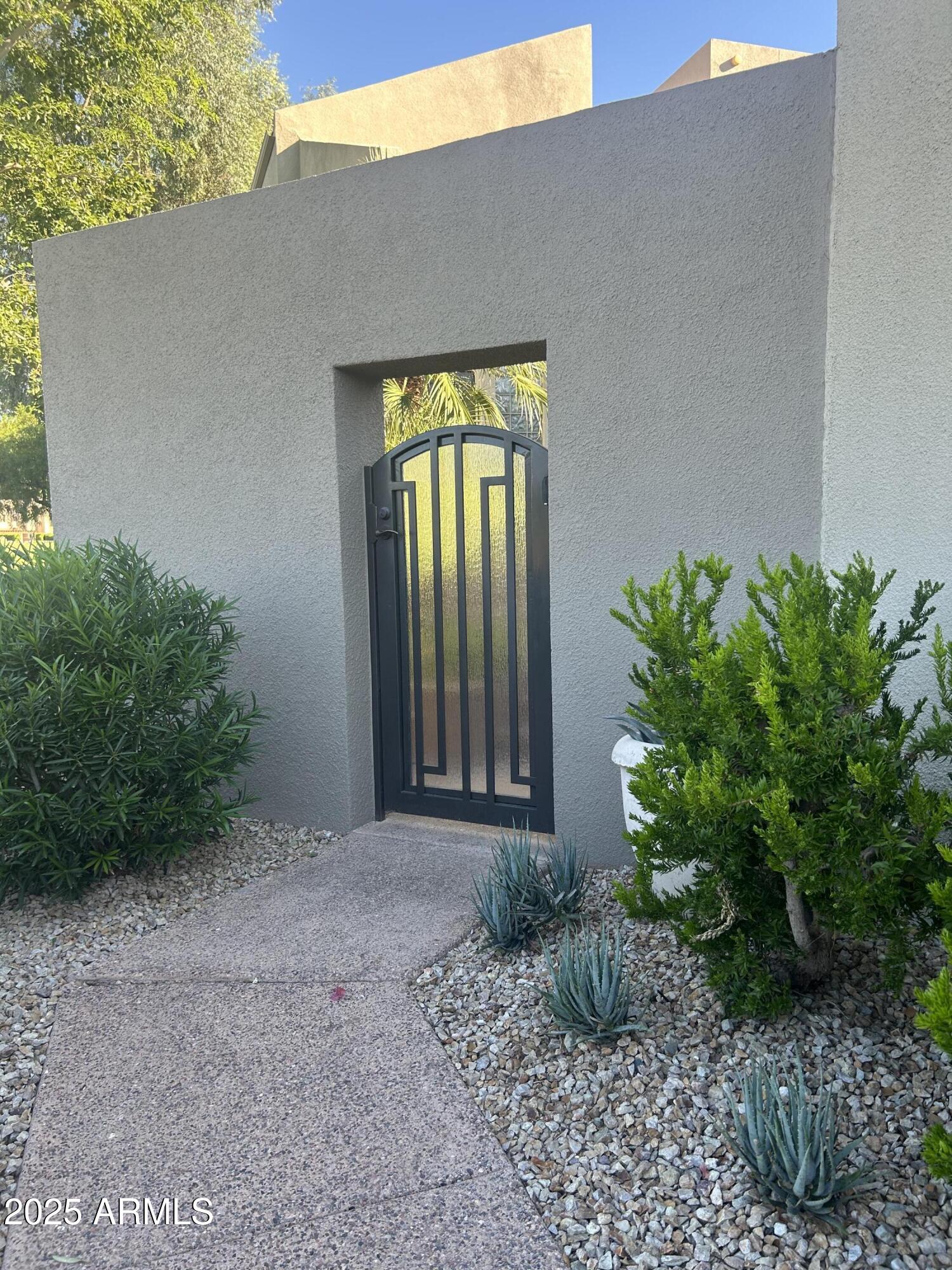 PRIVATE GATE INTO COURTYARD