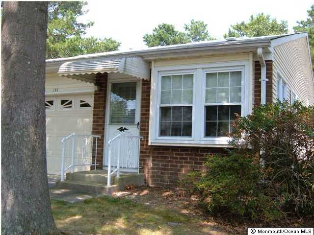 19A Sunset Road, Unit B Whiting, NJ 08759 - Photo 2 of 3 a front view of a house with a yard