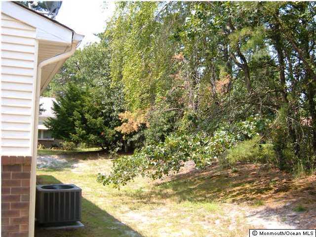 19A Sunset Road, Unit B Whiting, NJ 08759 - Photo 3 of 3 a view of a yard with wooden fence