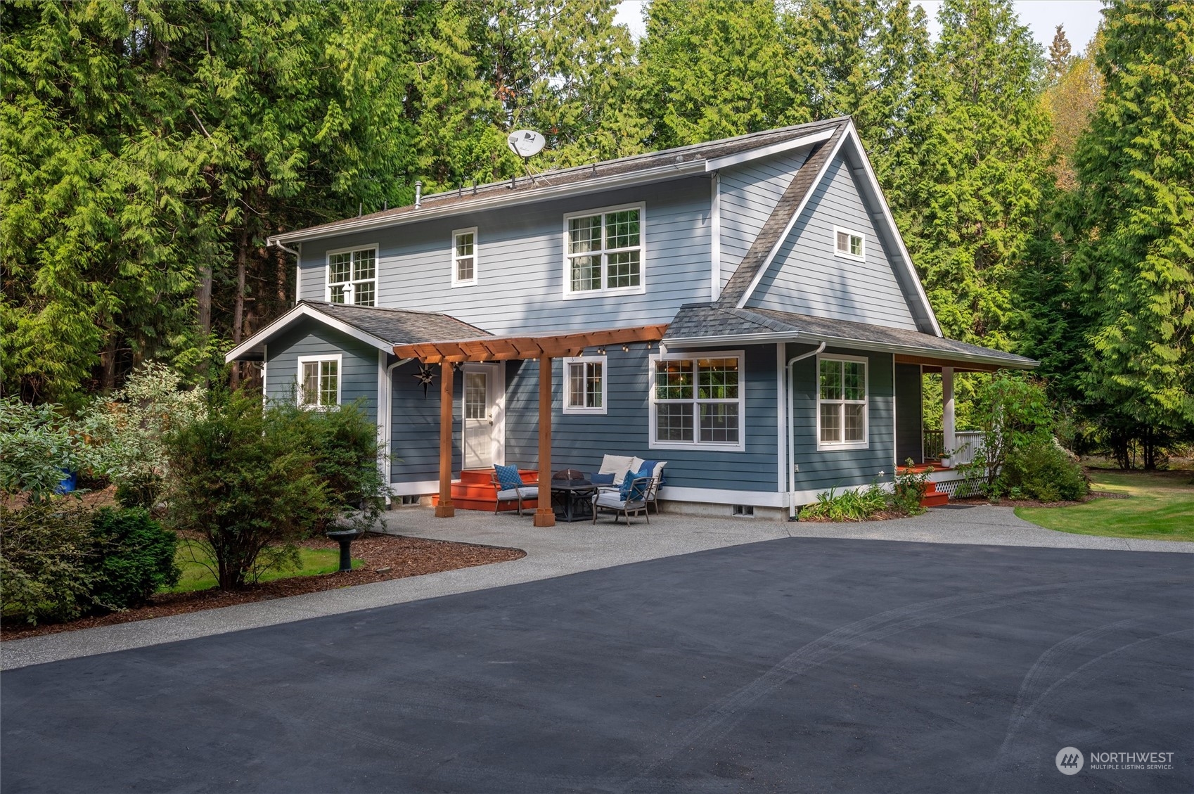 4161 Red Cedar Road Blaine, WA 98230 - Photo 29 of 40 a front view of a house with a yard and trees