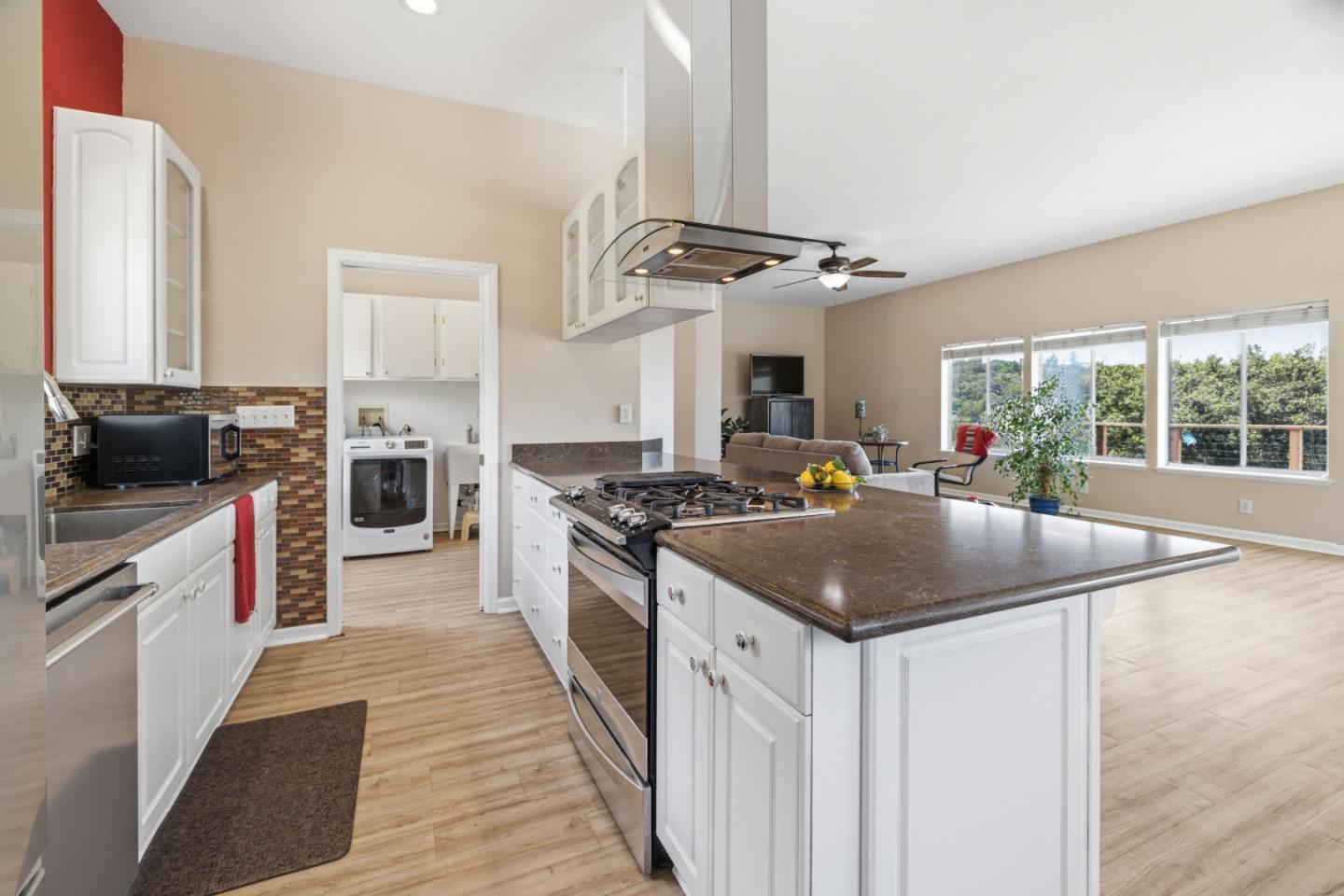 19269 Mallory Canyon Road, Unit D Salinas, CA 93907 - Photo 11 of 77 a kitchen with stainless steel appliances granite countertop a sink a stove and a refrigerator