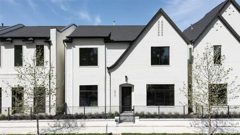 a front view of a house with garage