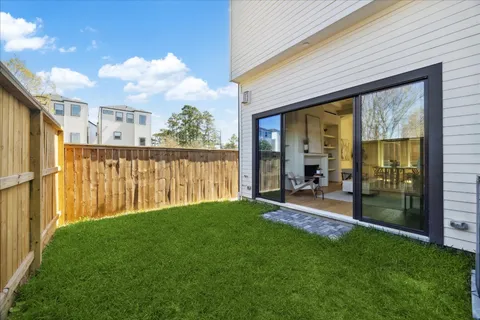 a view of a porch with chairs and backyard