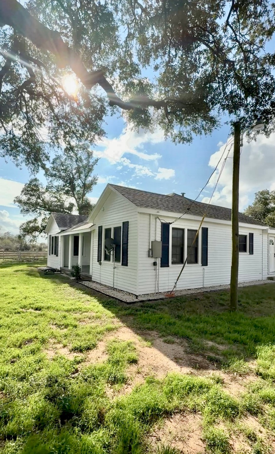 13309 Farm To Market 359 Hempstead, TX 77445 - Photo 14 of 34 a front view of house with yard space and trees around